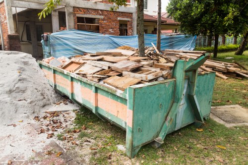 Professional office clearance team removing furniture